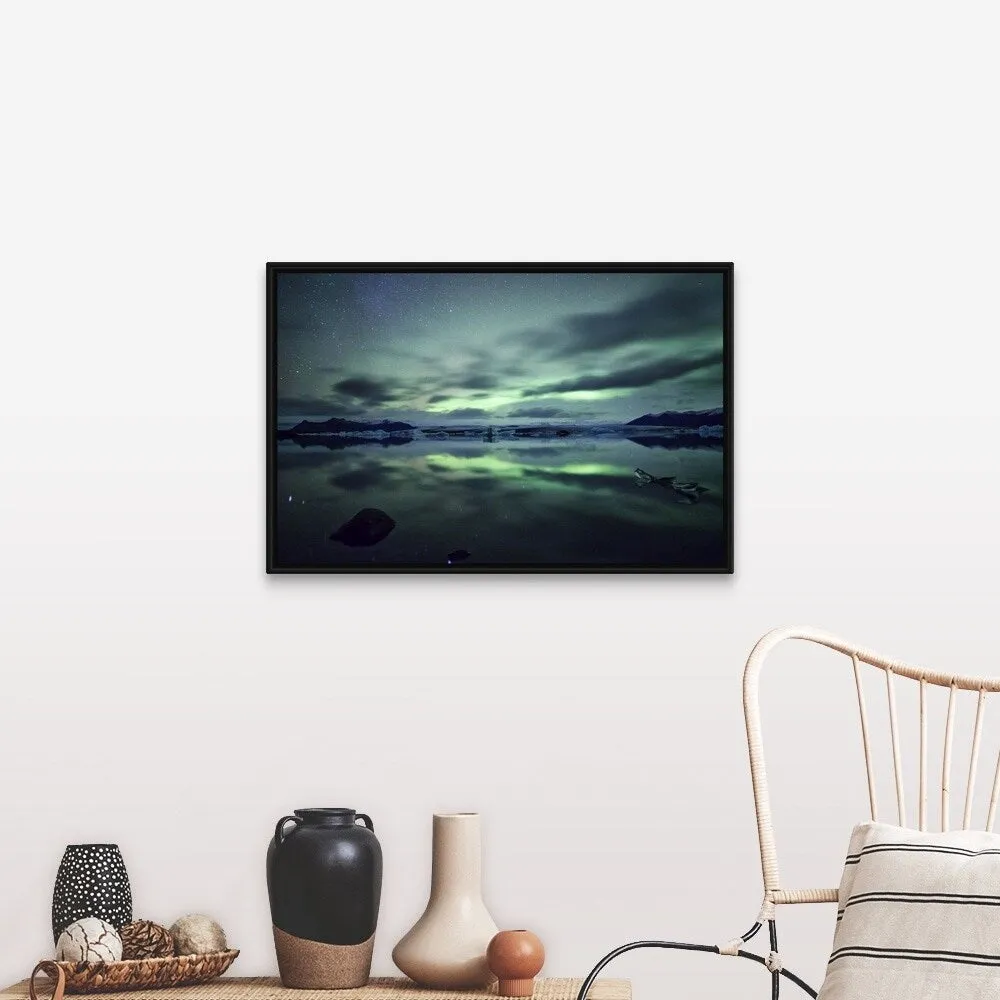 "Aurora borealis over Jokulsarlon glacial lagoon in south Iceland." Black Float Frame Canvas Art